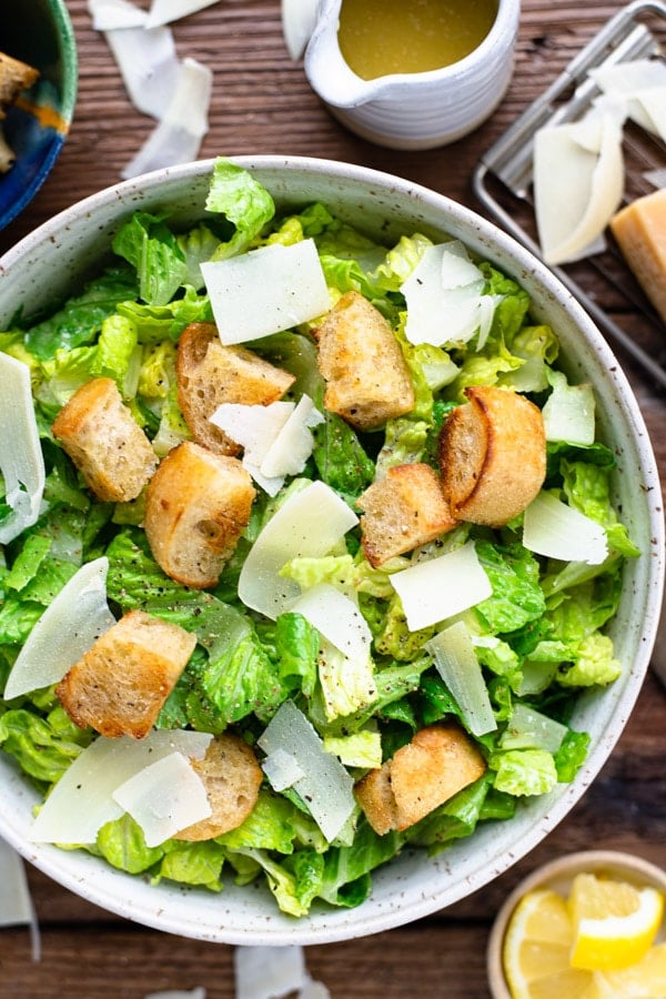 Close overhead shot of a big bowl of homemade Caesar salad recipe