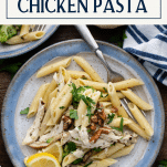 Overhead shot of a fork on a plate with creamy chicken pesto pasta with text title box at top