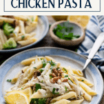 Side shot of a plate of creamy chicken pesto pasta with text title box at the top