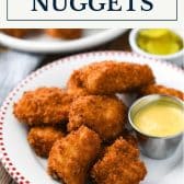 Plate of homemade chicken nuggets recipe with text title box at top