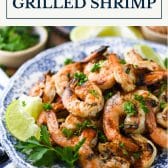 Grilled shrimp on a plate with text title box at top