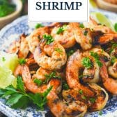 Plate of marinated grilled shrimp recipe with text title overlay.