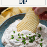 Dipping potato chip in bowl of French onion dip with text title box at top