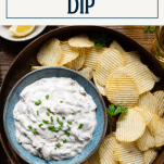 Platter of onion dip with side of potato chips and text title box at top