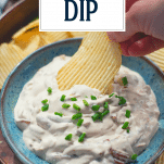 Dipping potato chip in French onion dip with text title overlay