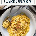 Close overhead shot of a bowl of authentic spaghetti carbonara with text title box at top