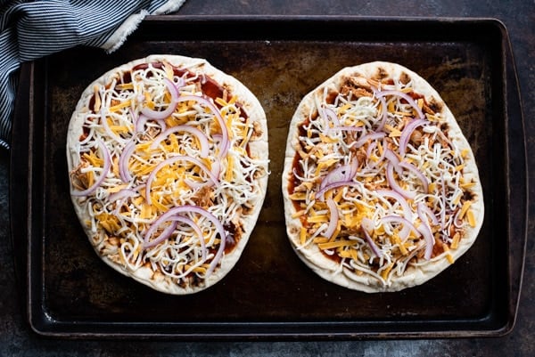 Process shot showing how to make bbq chicken pizza