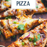 Close up shot of slices of homemade bbq chicken pizza with text title overlay