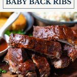 Tray of baked baby back ribs with text title box at top