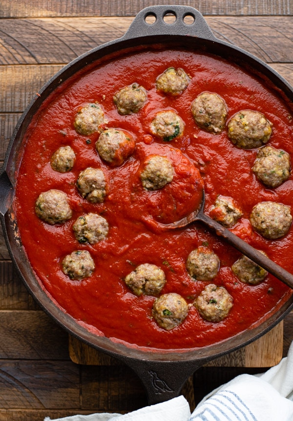 Baked meatballs in sauce in a skillet
