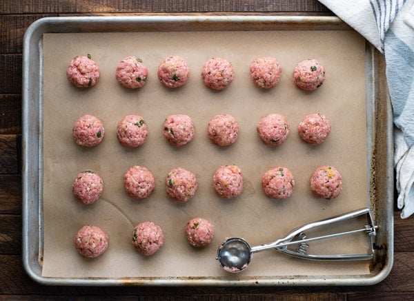 Process shot showing how to make baked meatballs in oven