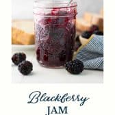 Jar of homemade blackberry jam with text title at the bottom.