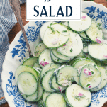 Overhead shot of a bowl of cucumber dill salad with text title overlay