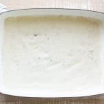 Sour cream sauce in a white dish