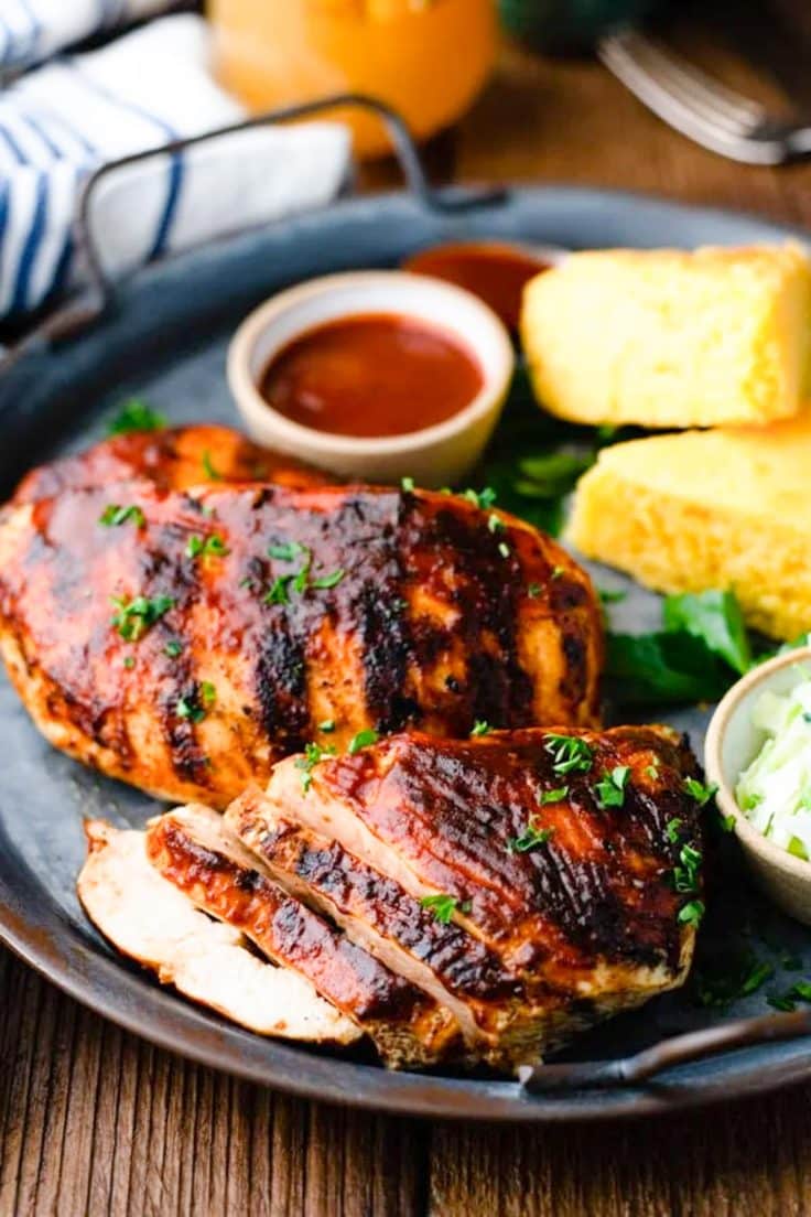 Sliced grilled bbq chicken breast on a platter