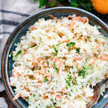 Close overhead image of homemade coleslaw in a serving bowl