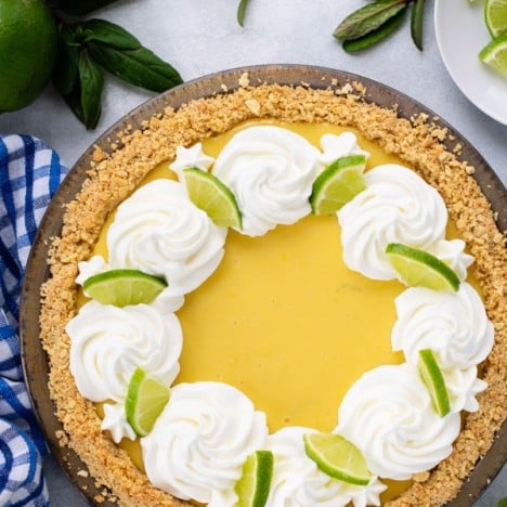 Overhead shot of homemade key lime pie recipe on a white surface