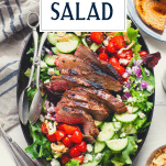 Overhead shot of steak salad with text title overlay