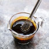 Whisking together the molasses and sauce for a batch of homemade baked beans.