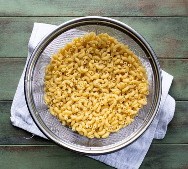 Cooked macaroni pasta in a colander
