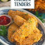 Close up shot of a plate of baked chicken tenders with text title box at top