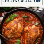 Overhead shot of a pan of hunter style chicken cacciatore with text title box at top