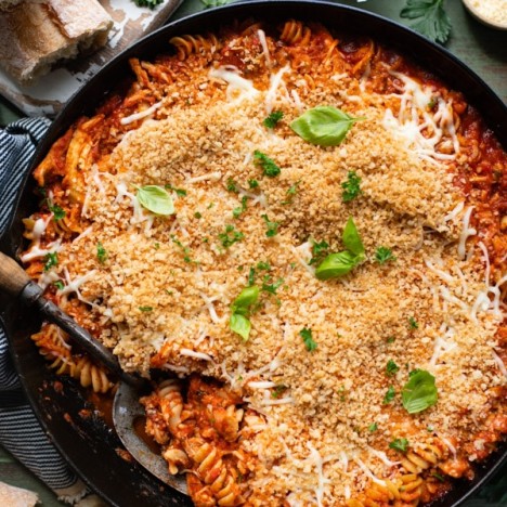 Overhead image of a chicken parmesan casserole with panko breadcrumbs on top
