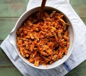 Process shot showing how to make chicken parmesan casserole