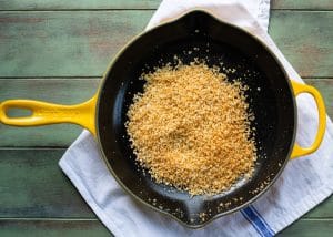 Toasted garlic panko breadcrumbs in a cast iron skillet