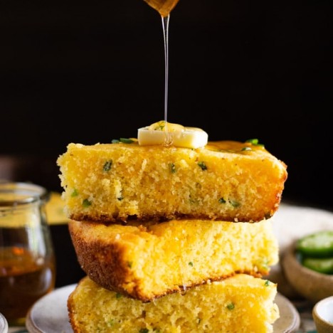 Drizzling honey on Mexican cornbread