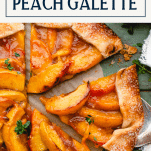Overhead shot of a sliced spiced peach galette with text title box at top