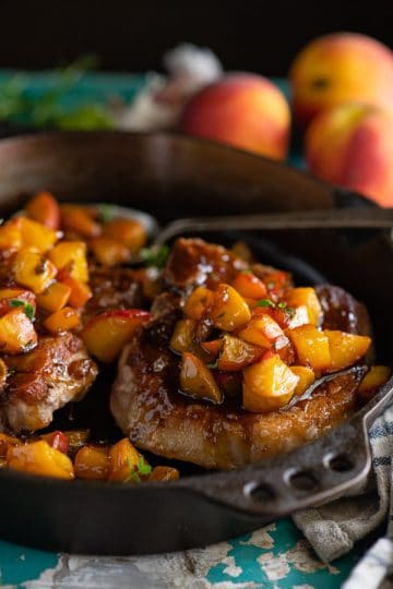 Pan Fried Pork Chops with Peach Sauce - The Seasoned Mom