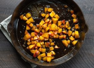 Peach sauce in a cast iron skillet