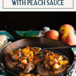 Side shot of pork chops with peach sauce in a skillet with text title box at top