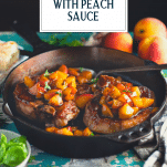 Side shot of pork chops with peach sauce and text title overlay