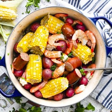 Square overhead shot of frogmore stew in a dutch oven.