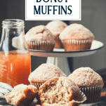 Apple cider donut muffins on a table with text title overlay