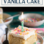 Candle in a slice of homemade vanilla cake with text title box at top