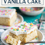 Fork taking a bite of fluffy vanilla cake with text title box at top