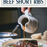Pouring red wine on a bowl of braised beef short ribs with text title box at top