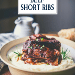 Side shot of a bowl of red wine braised beef short ribs with text title overlay