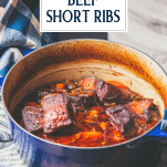 Dutch oven with braised beef short ribs and text title overlay