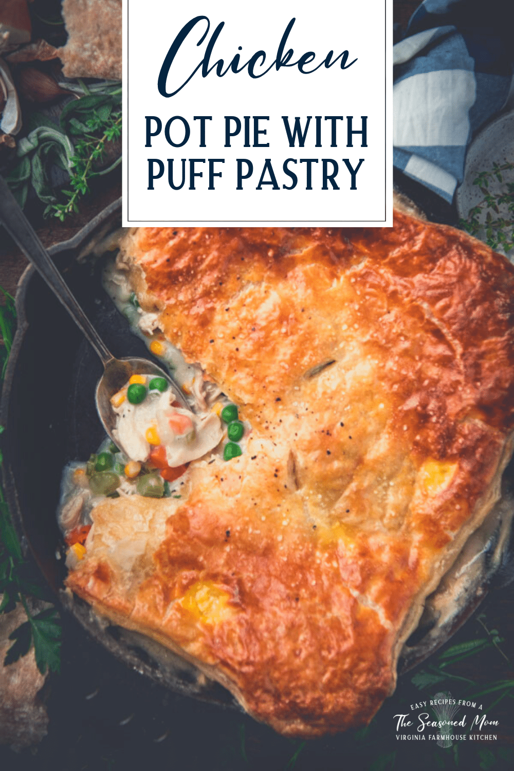 Overhead shot of a spoon in a pan of chicken pot pie with puff pastry and text title overlay
