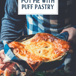Hands holding a pan of chicken pot pie with puff pastry and text title overlay