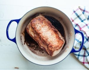 Seared pork loin roast in a Dutch oven