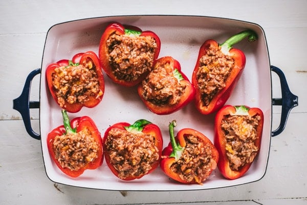 Process shot showing how to make ground turkey stuffed peppers.