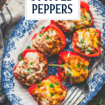 Overhead shot of a tray of ground turkey stuffed peppers with text title overlay