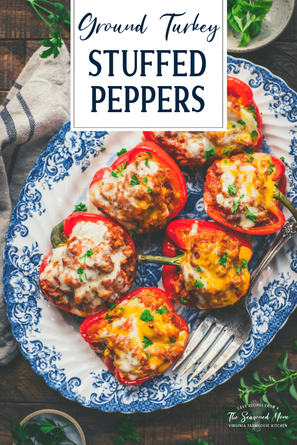 Overhead shot of a tray of ground turkey stuffed peppers with text title overlay
