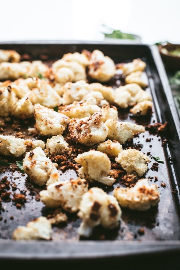 Side shot of a sheet pan with parmesan roasted cauliflower