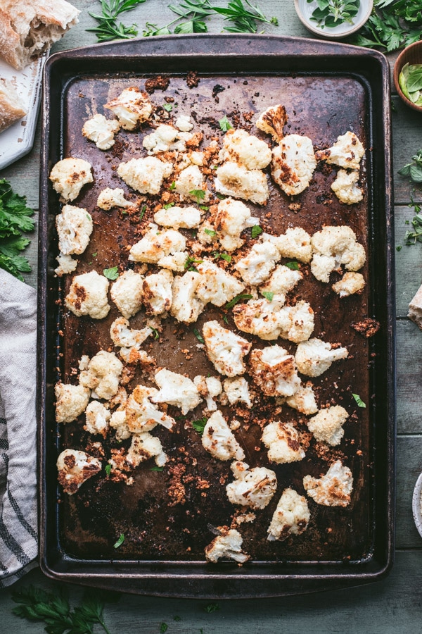 Overhead shot of a rimmed baking sheet full of parmesan crusted roasted cauliflower